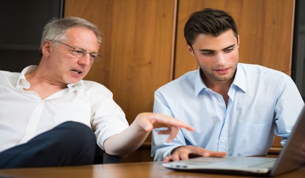 two men are studying