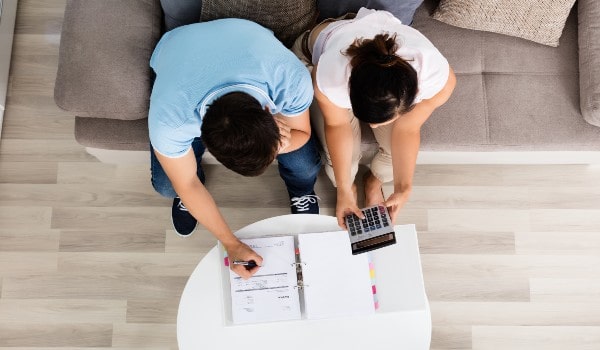 two people are sitting on couch