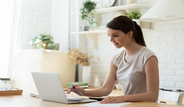 a young girl is working happily