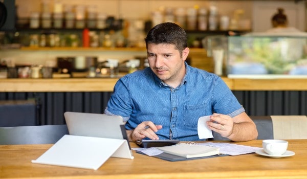 a young man is calculating