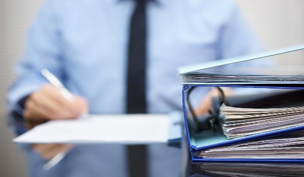 a young boy is holding a file