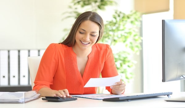 a girl is working and smiling