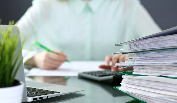 a bookkeeper is working to maintain reports