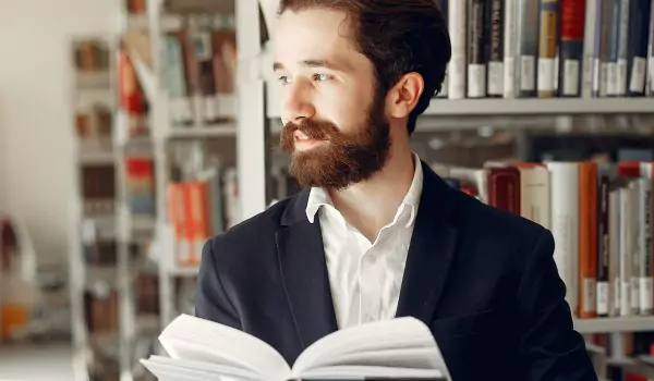 young man reading a book