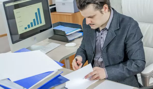 young man doing office work at his office